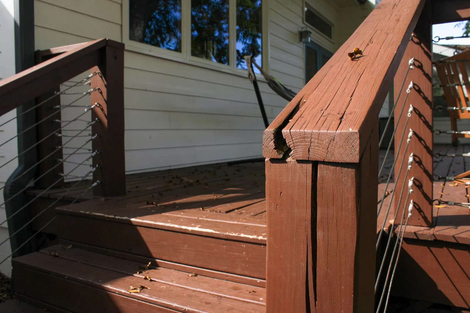 Cracked deck railing how to tell if deck boards need replaced service in Marietta GA by Nelson Exteriors