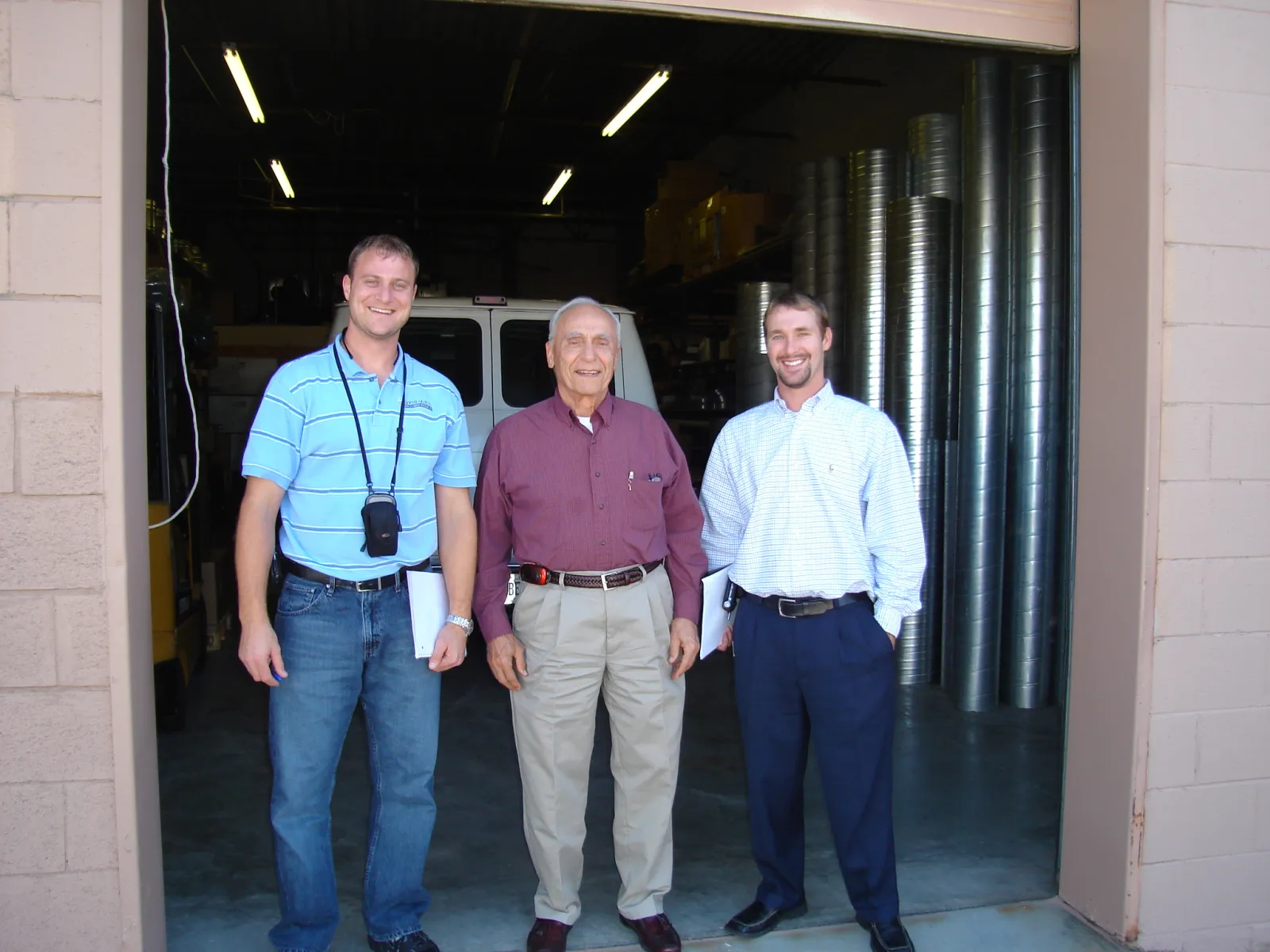 North-Georgia-Replacement-Windows-Owners-Standing-Outside-Building