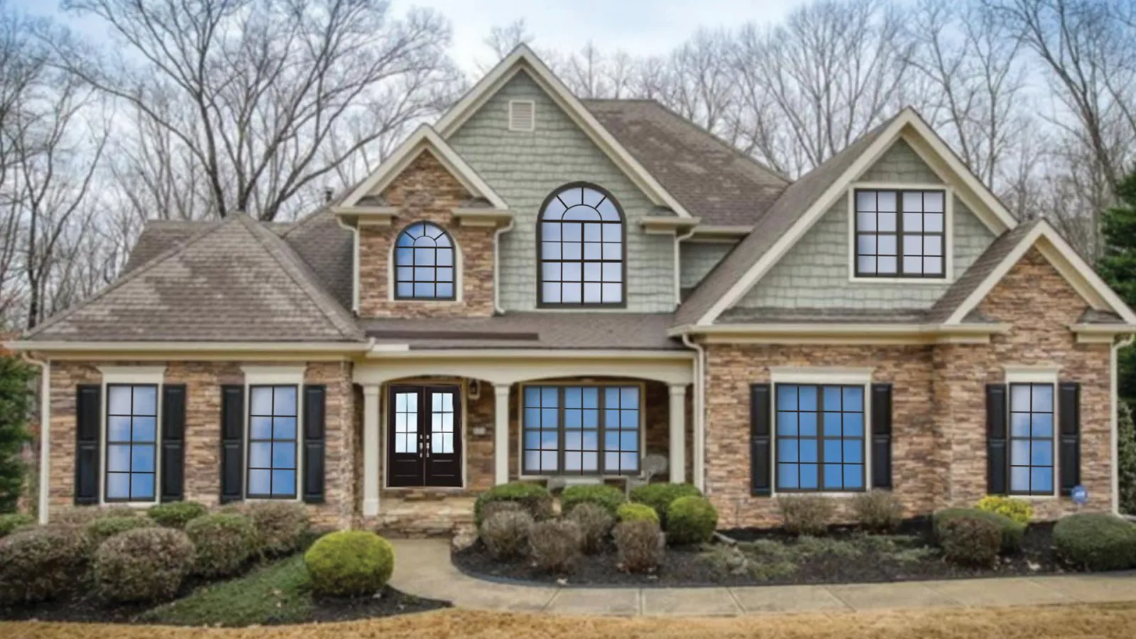 Stone and siding home with a rendering of what new windows and a new front door could look like.