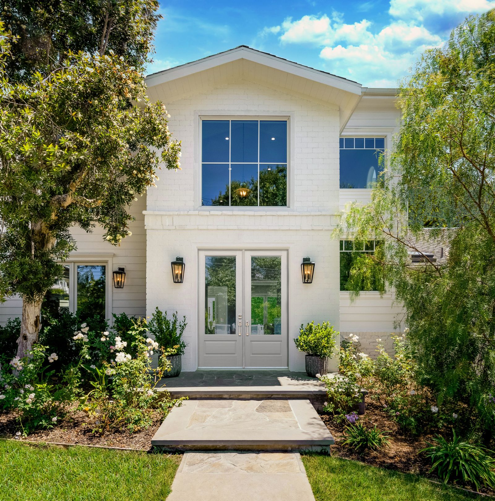 Infinity from Marvin Doors on a white brick home from North Georgia Replacement Windows