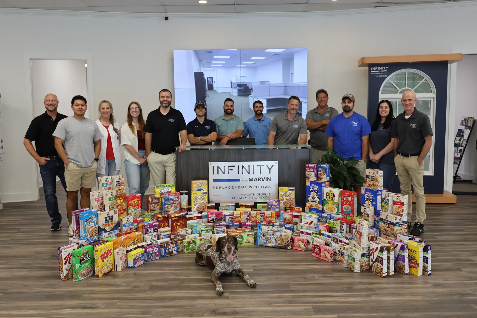 North Georgia Replacement Windows' employees pose in front of food donations