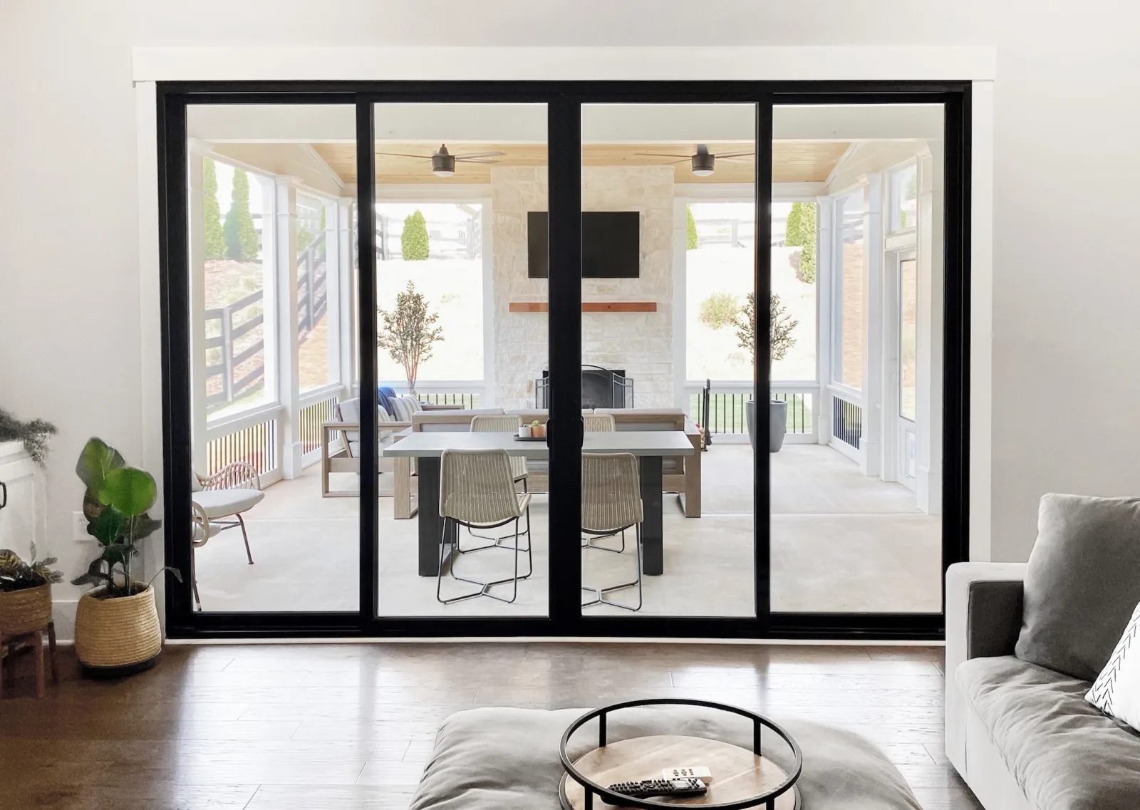 Black Infinity from Marvin Fiberglass Sliding door installation provides view onto outdoor living areas from living room