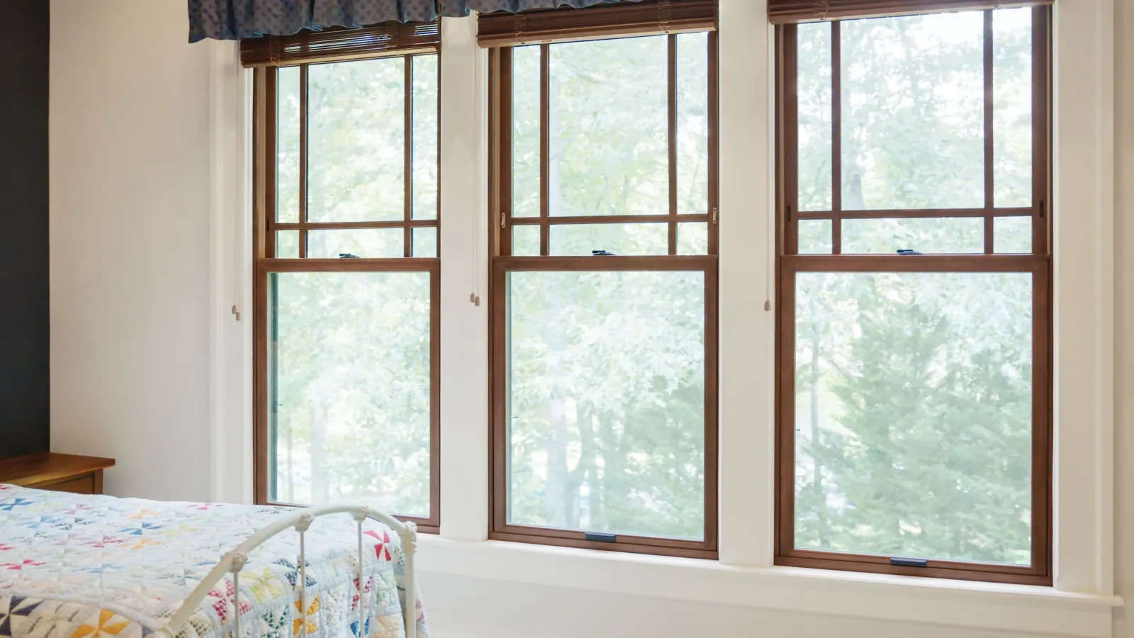 Triple-window configuration with brown double hung windows, a popular window replacement style for residential homes in Nashville, TN.