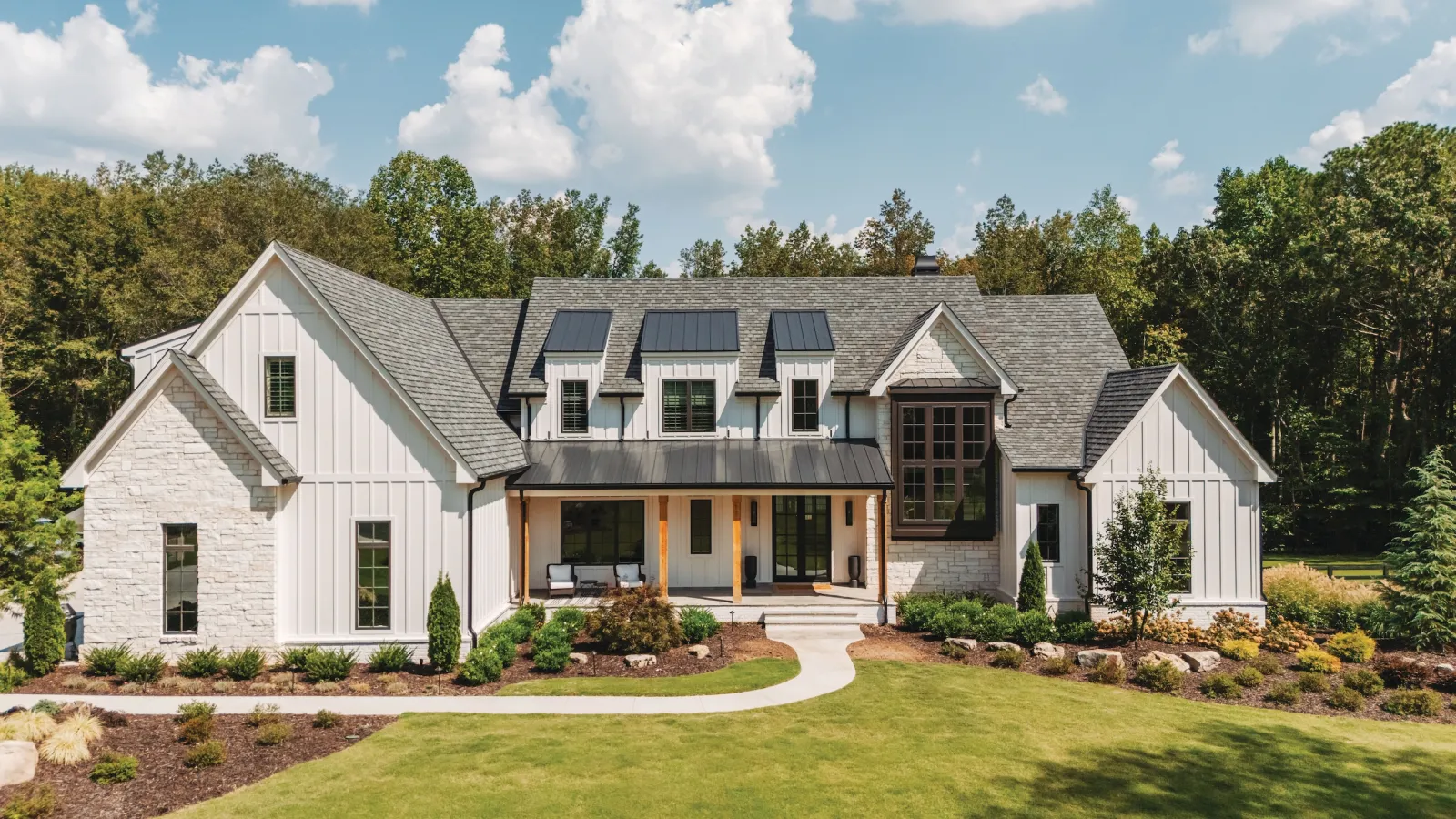 Modern farmhouse window installation in Nashville, TN, showcasing the popular black-on-white exterior trend with high-efficiency glazing.
