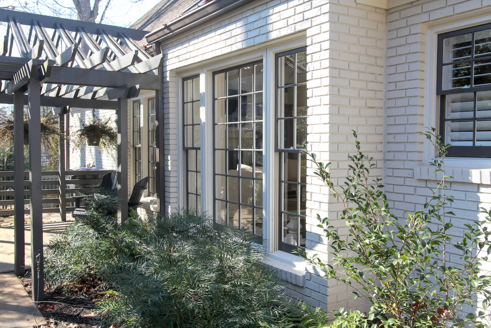 a house with a deck and plants