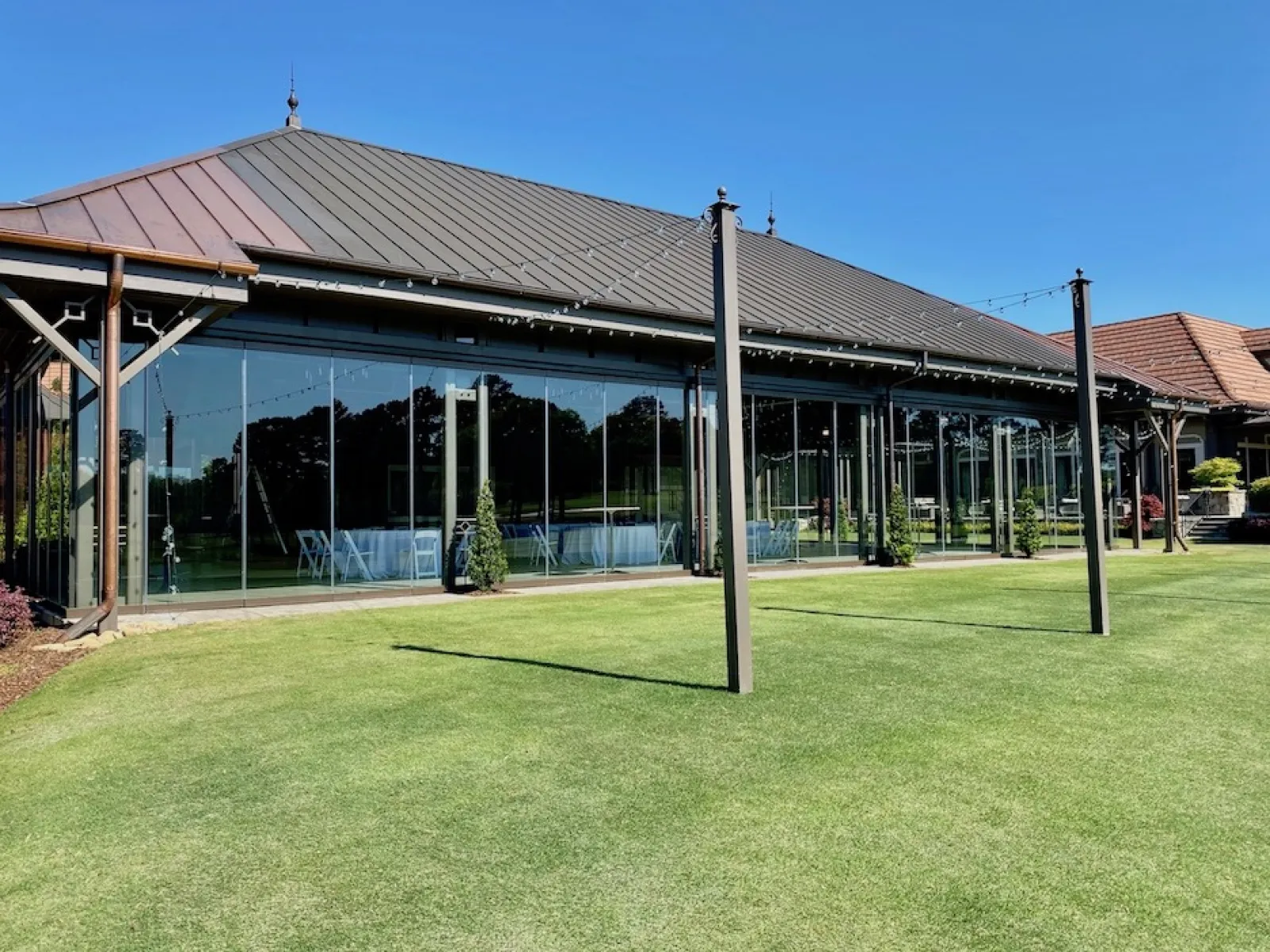 a building with a green lawn