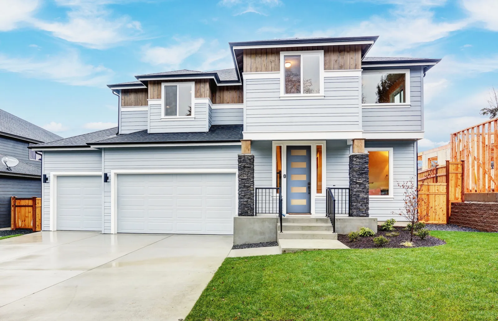 Modern 2 story house with modern blue front door