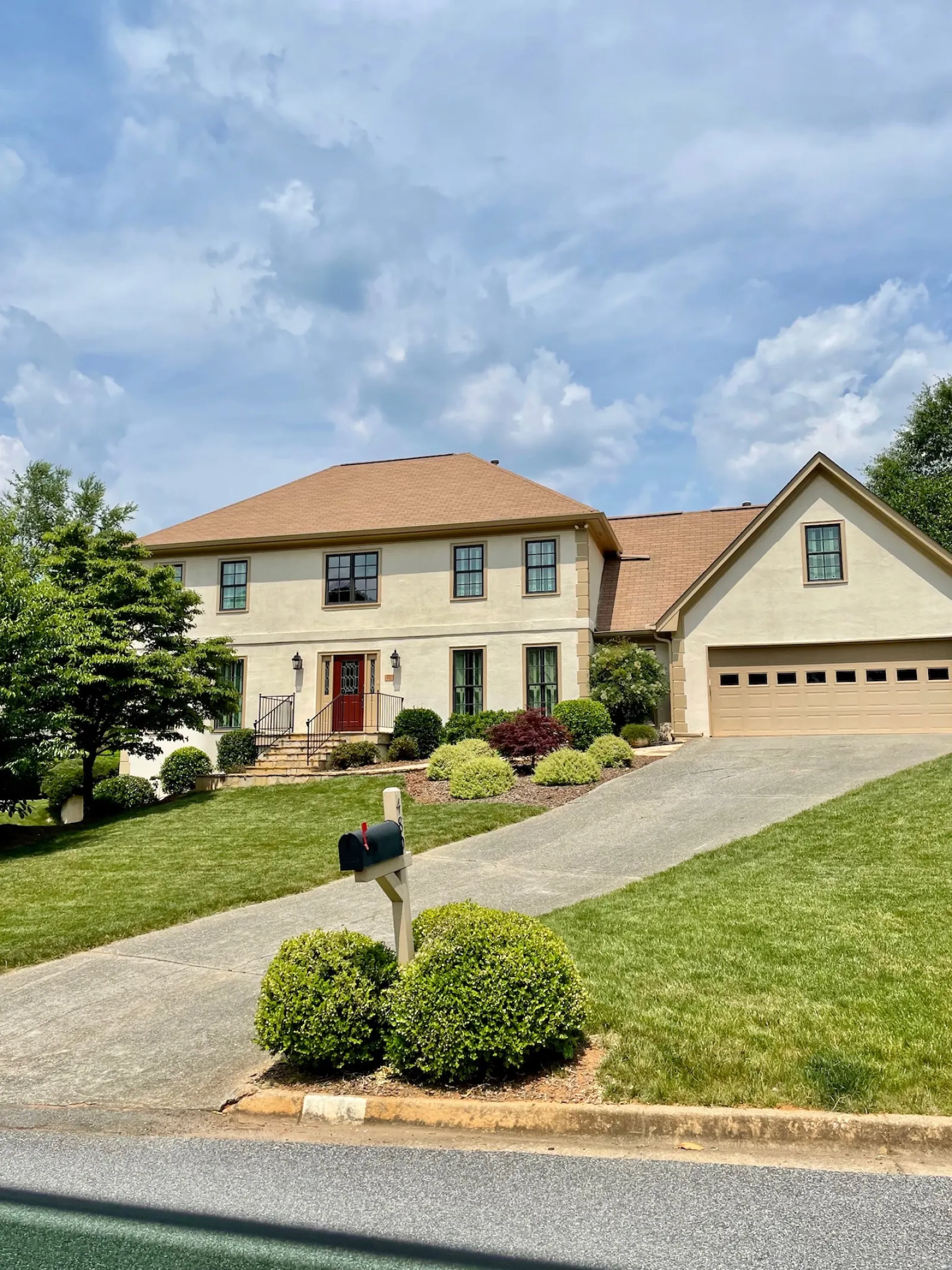 a house with a lawn and trees