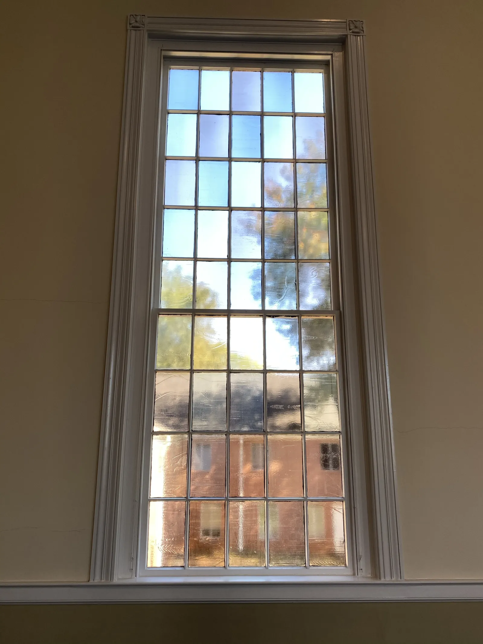a window with a view of trees