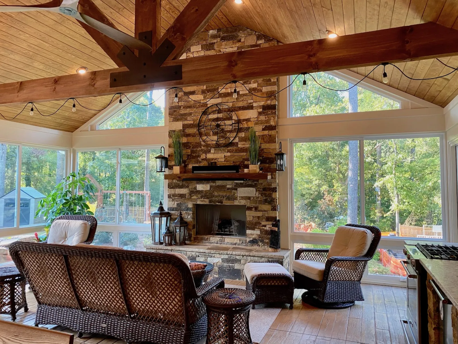 a room with a fireplace and chairs
