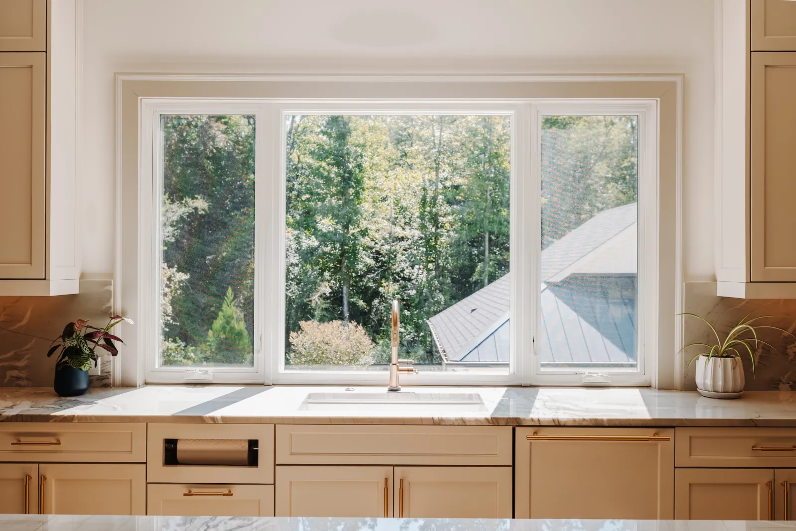 Infinity Windows - White fiberglass sliding windows over kitchen sink