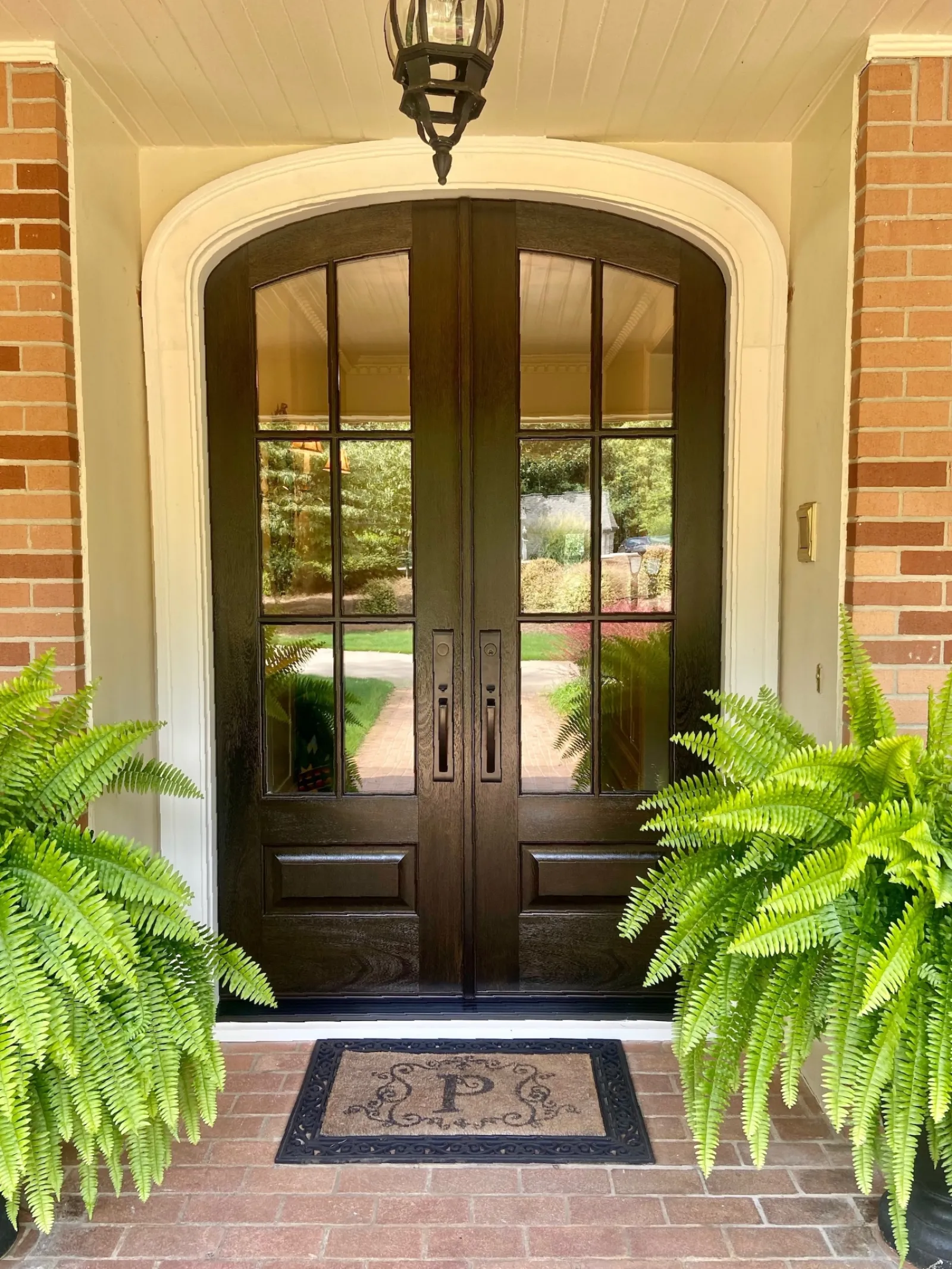 Arched double entry door on brick house installed by North Georgia Replacement Windows