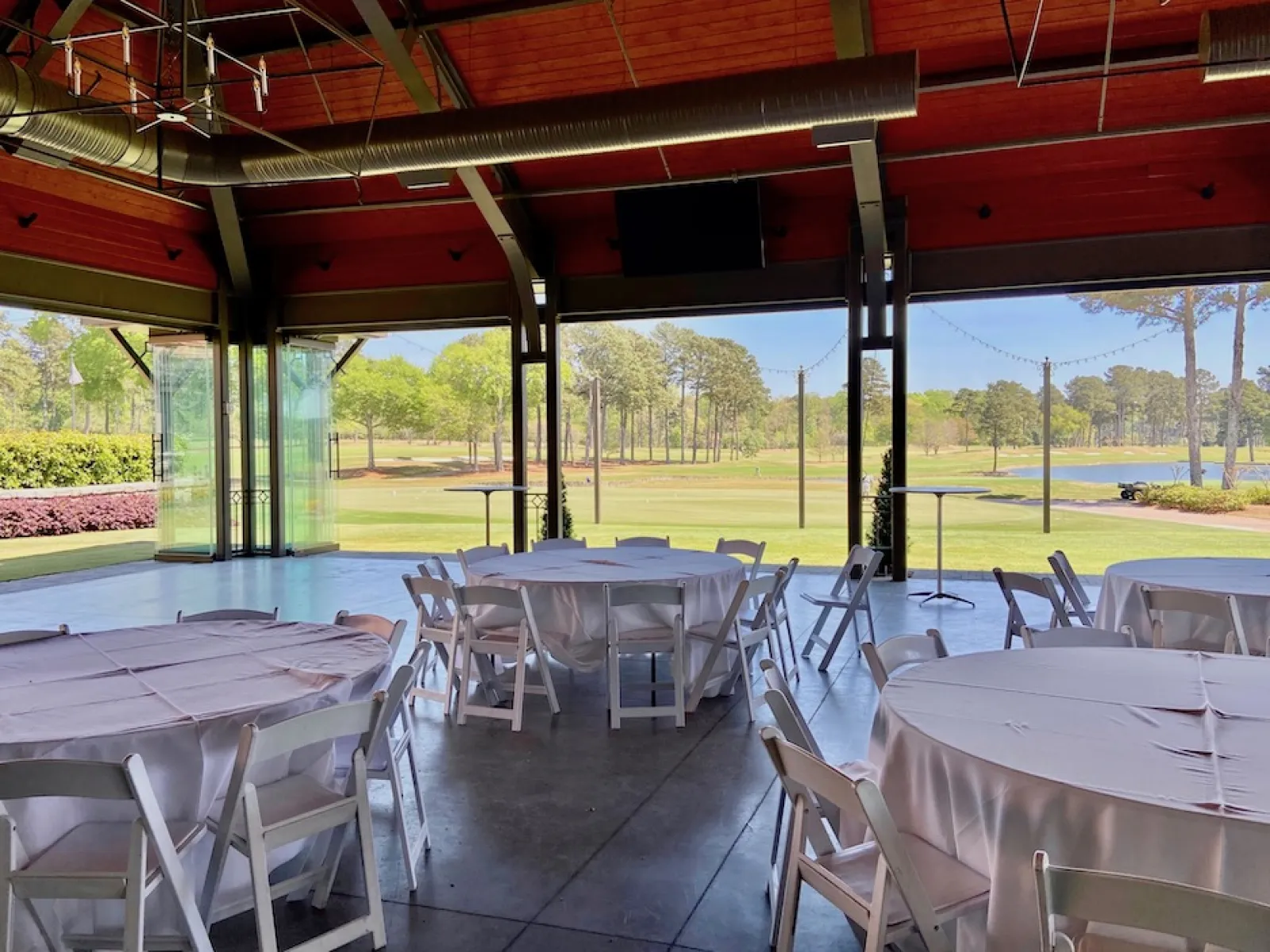 a group of tables and chairs outside