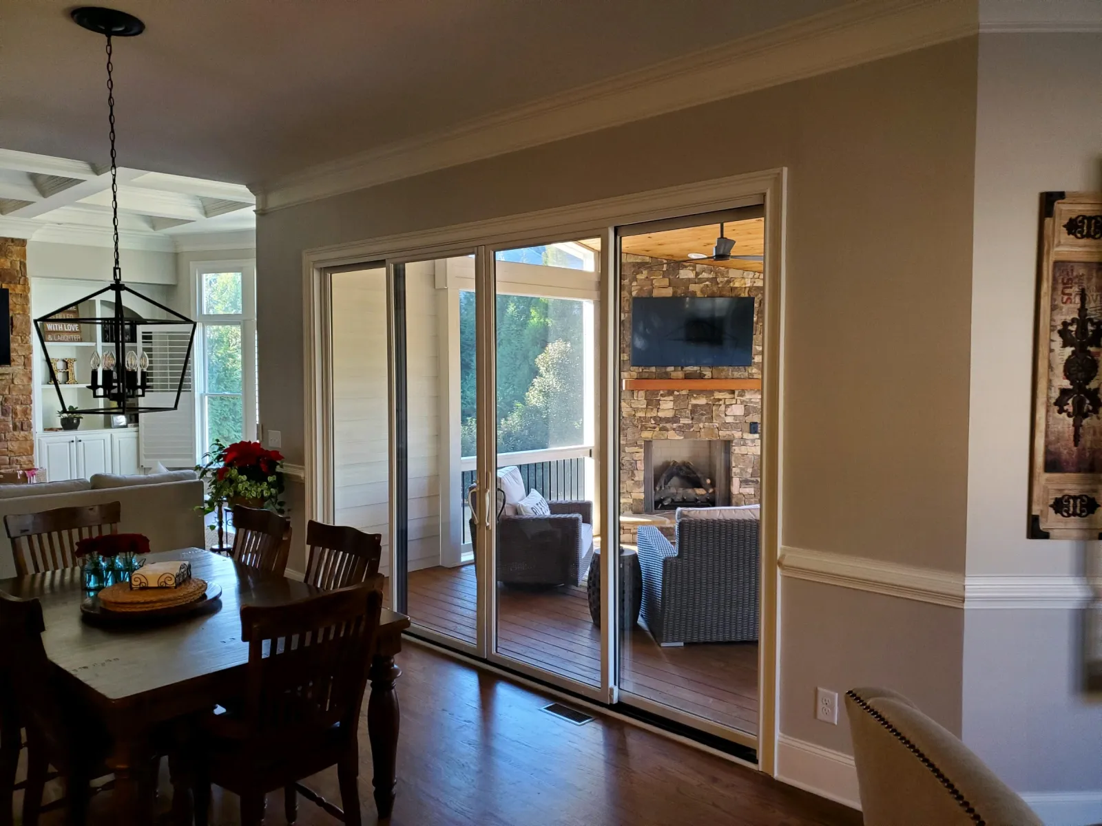a dining room with a large glass door