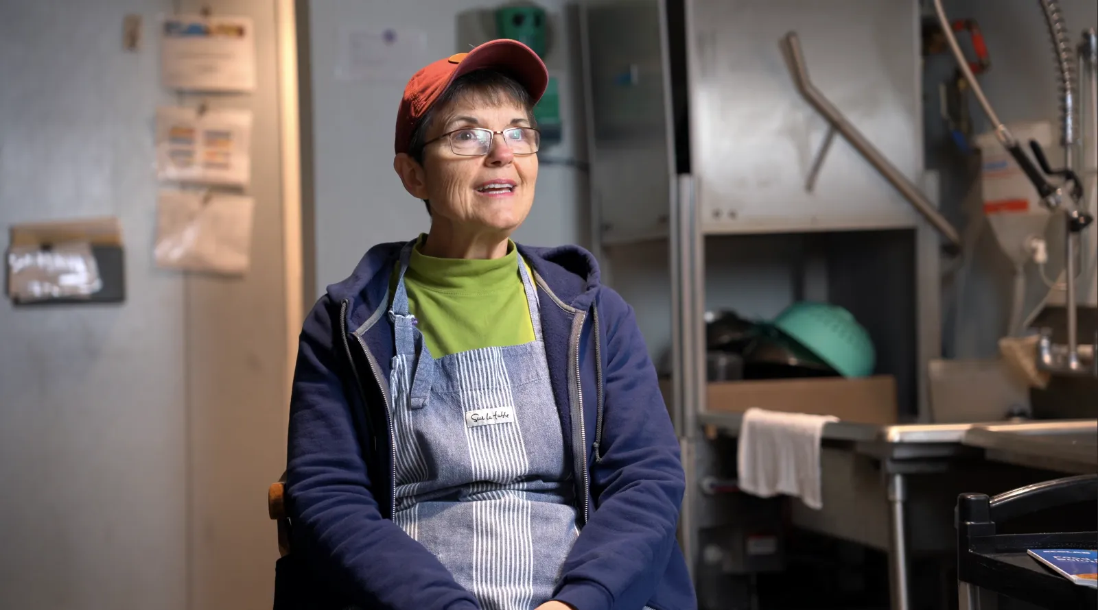 a person wearing a hat and glasses