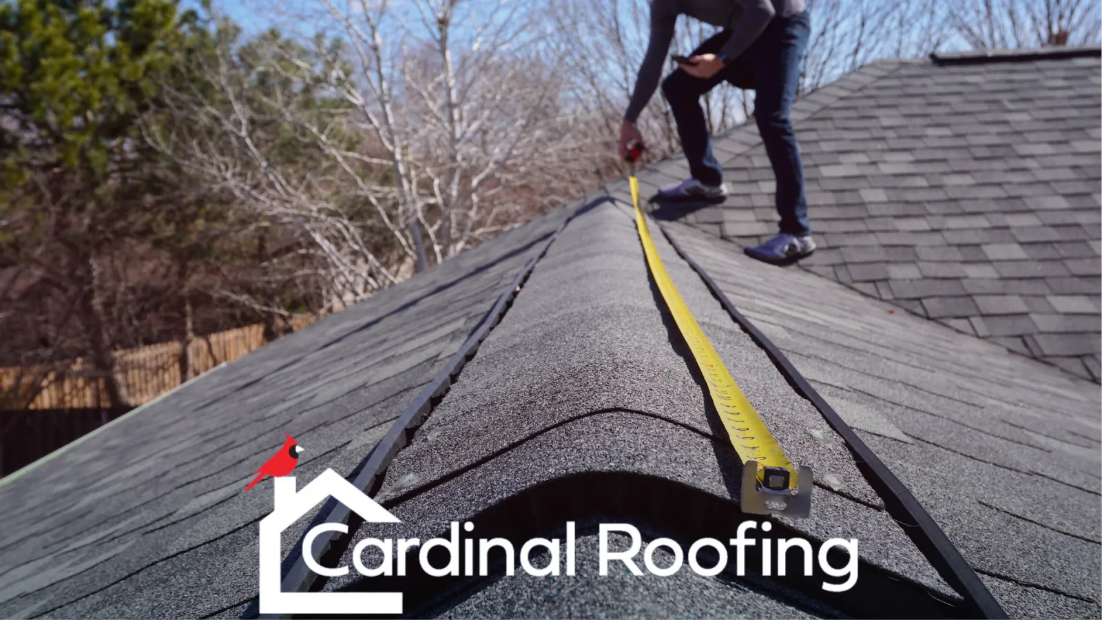 Cardinal roofing image with worker on roof