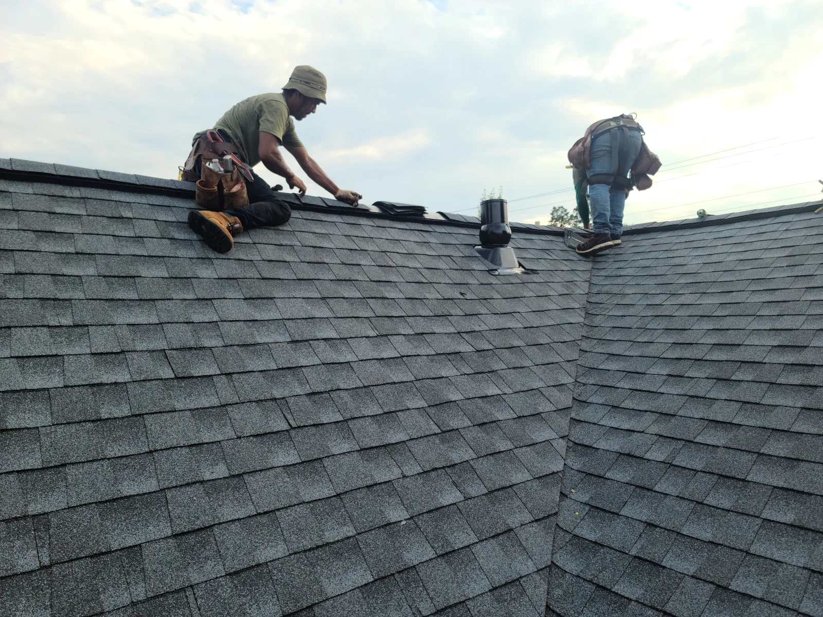 Workers fixing roof