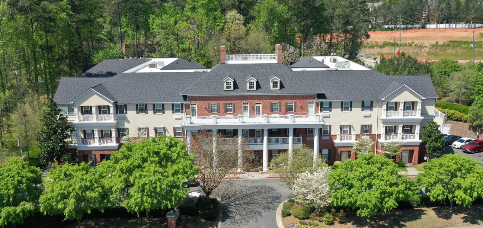 a large house with trees in the front