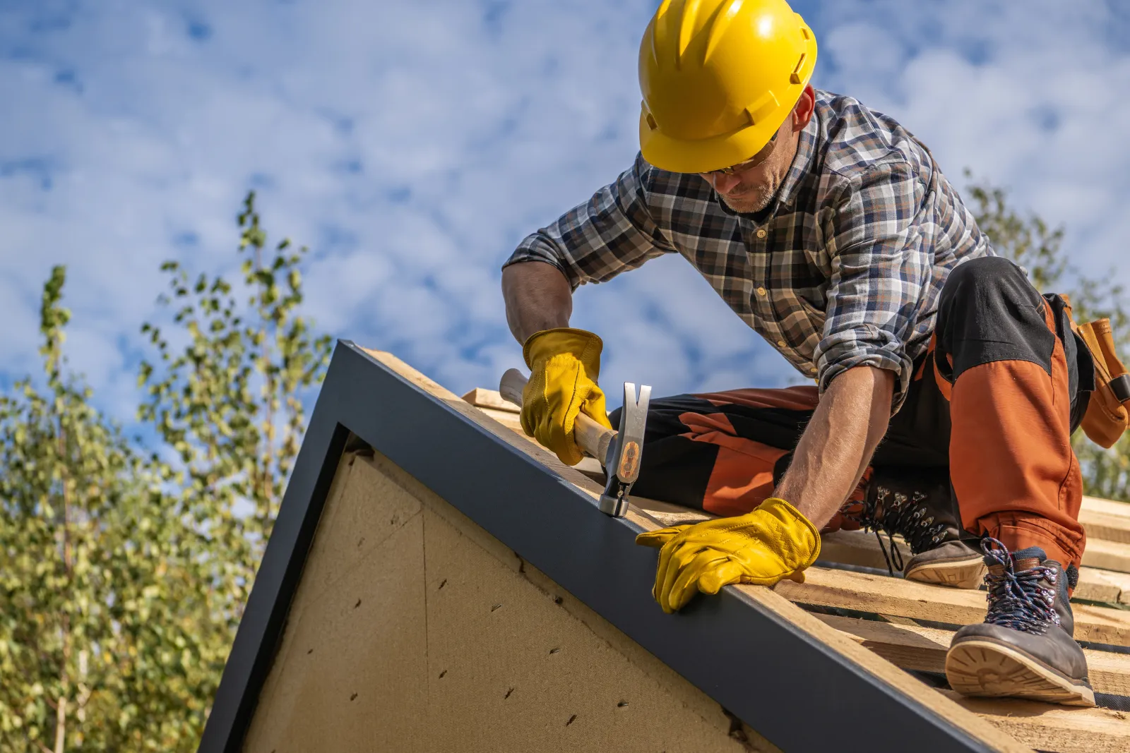 Worker working on roof