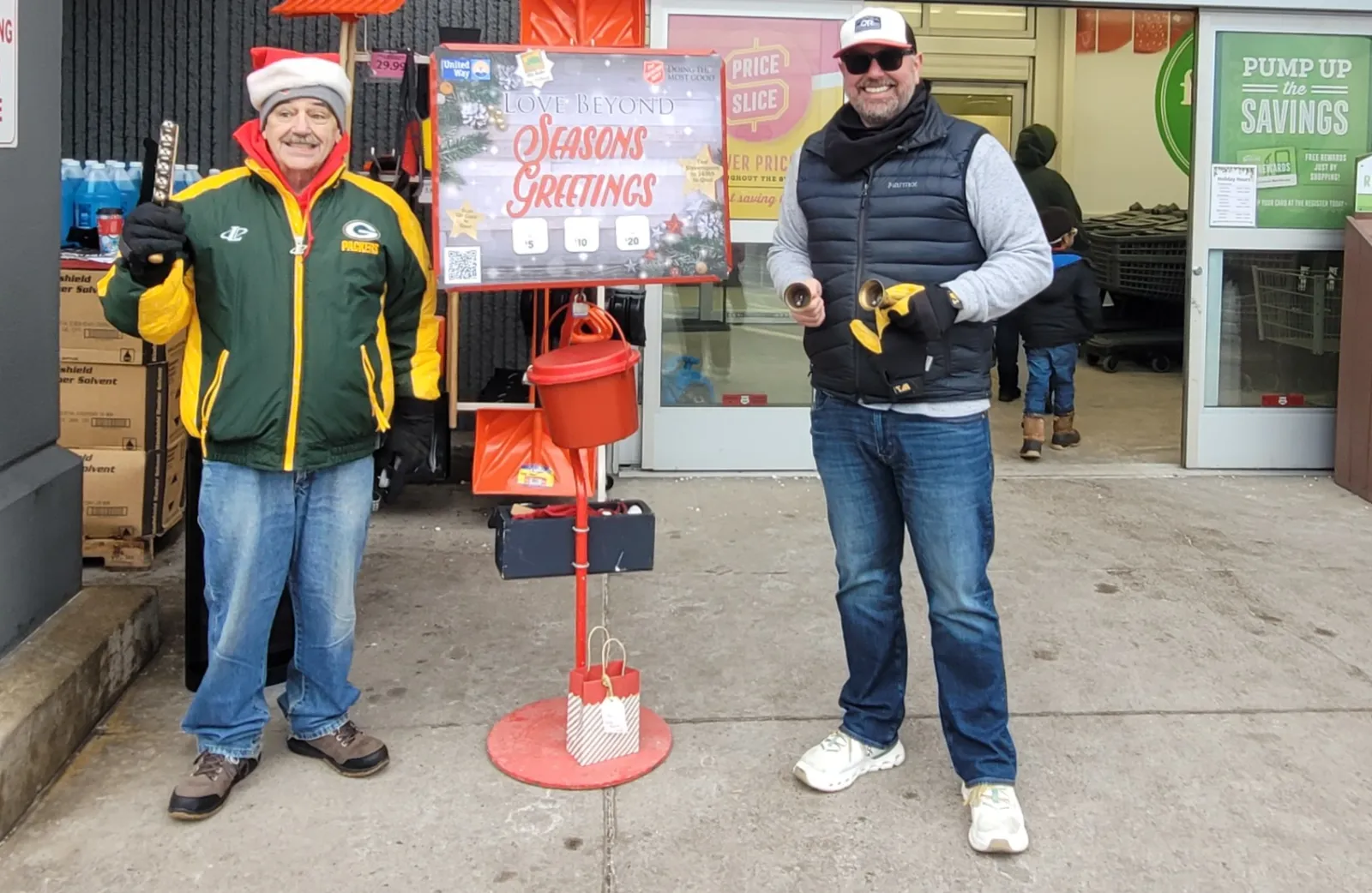 a couple of men standing next to a fire hydrant