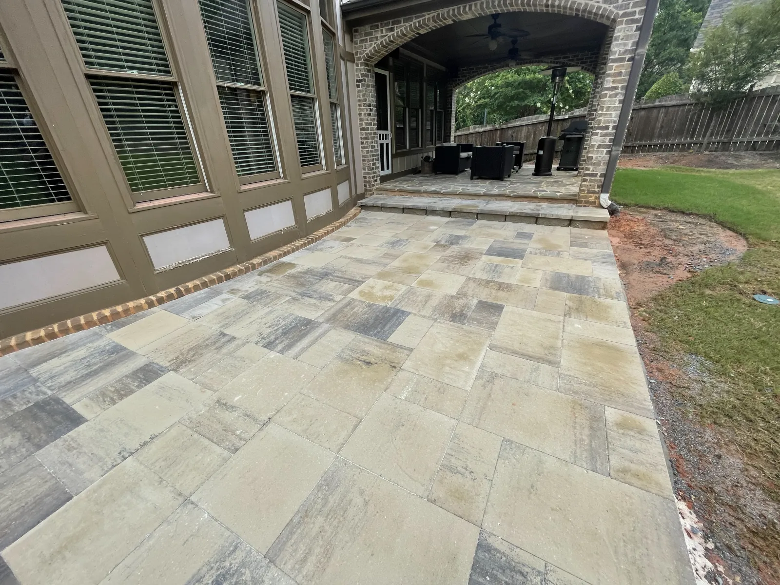 a stone patio with a stone walkway