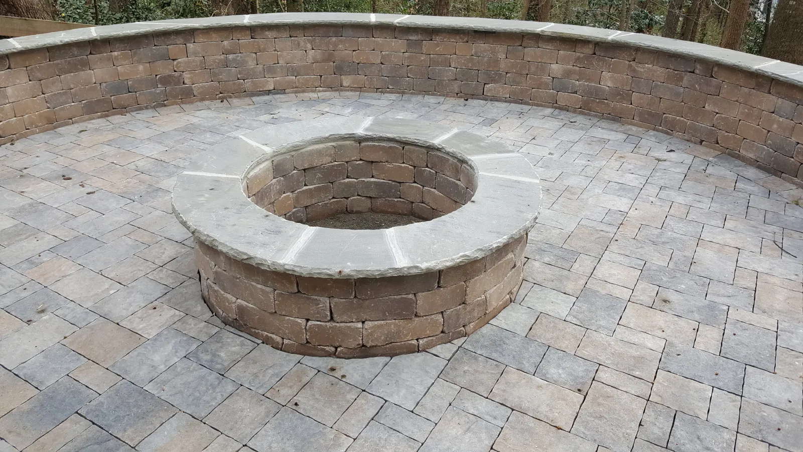 a circular object on a brick surface