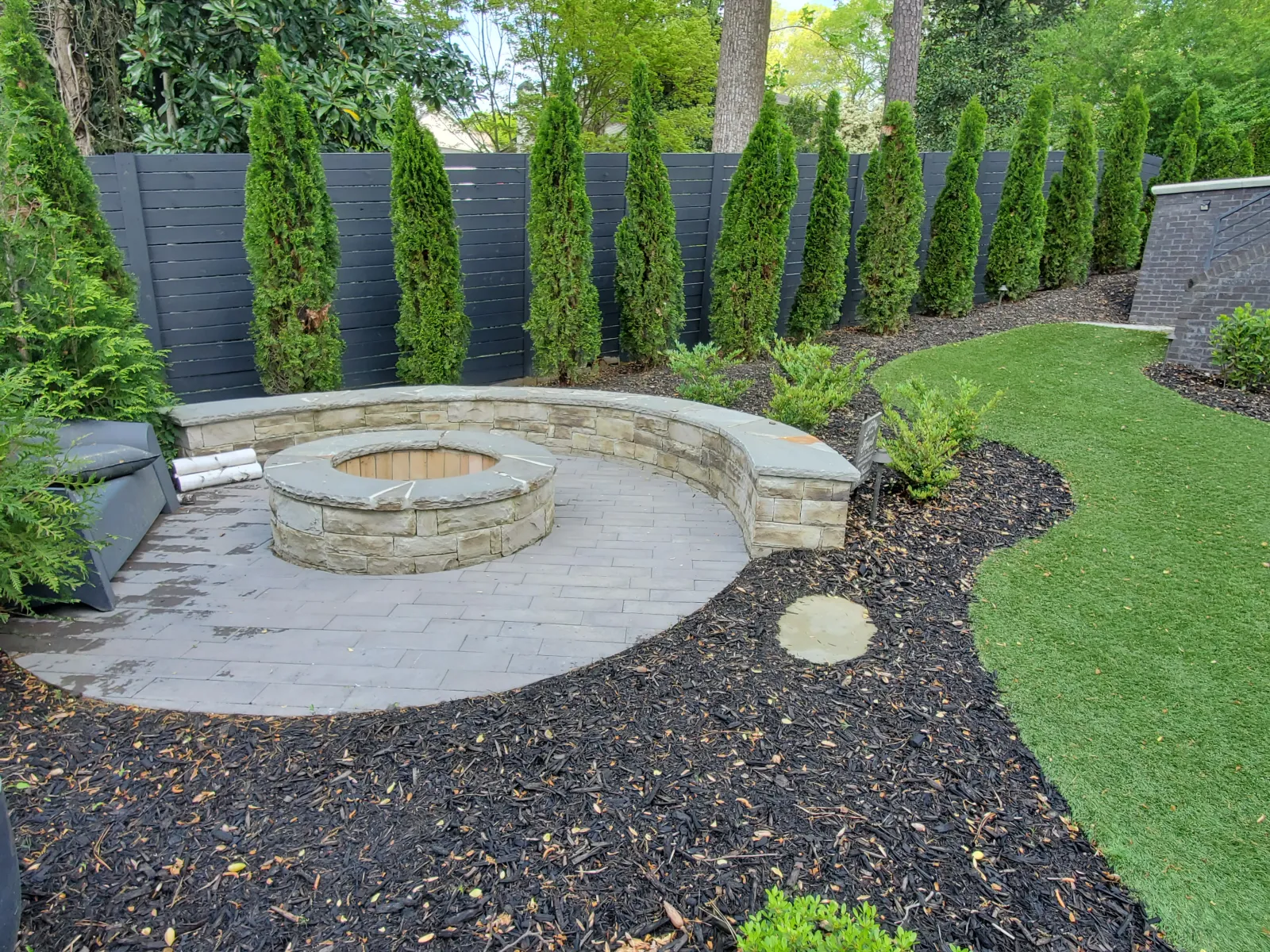 a stone fountain in a garden