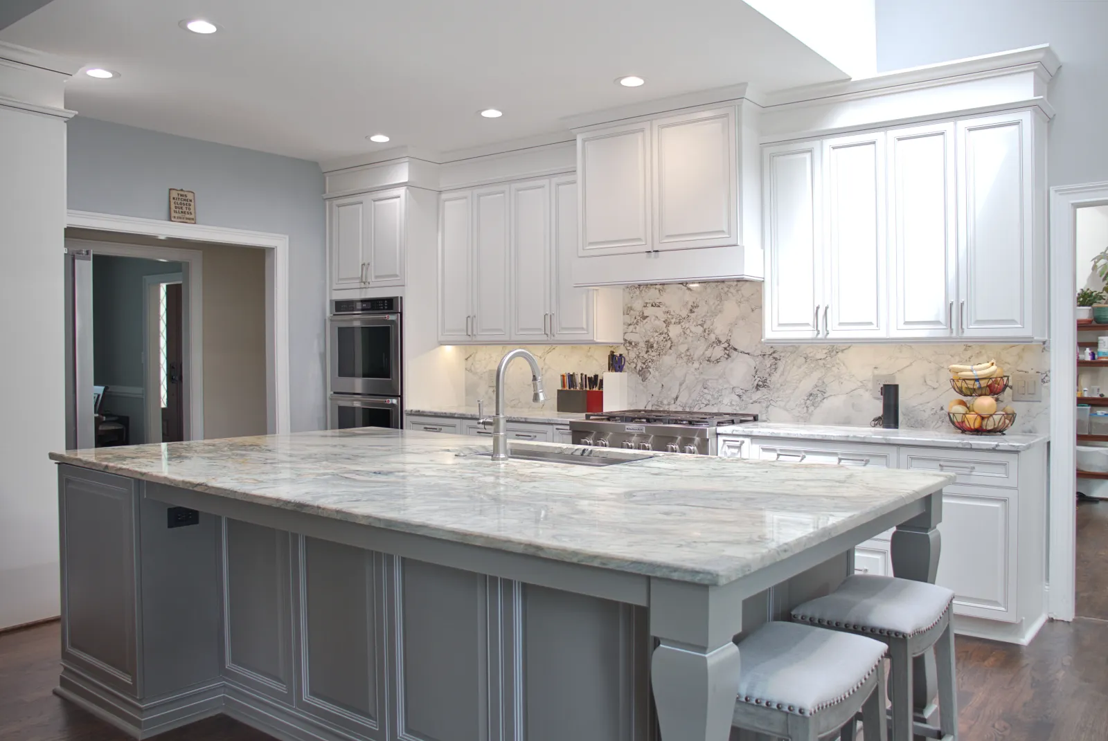 a kitchen with marble counters