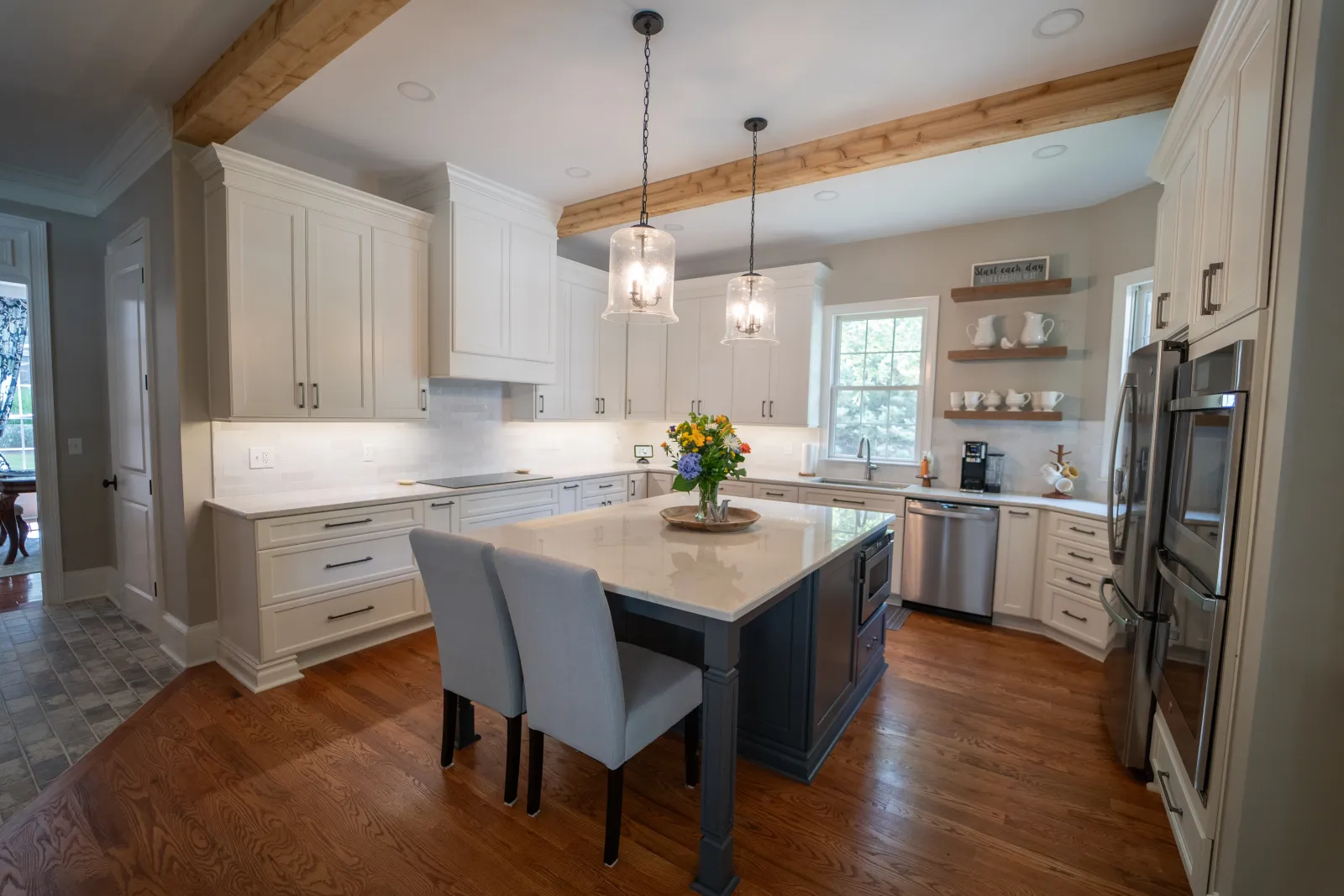 a kitchen with a dining table and chairs