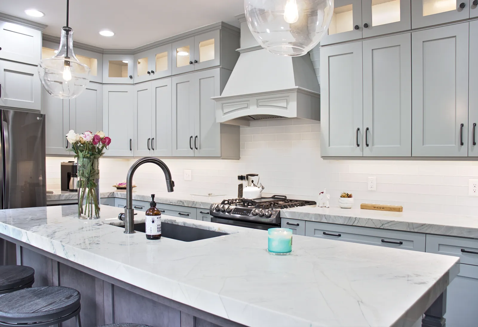 a kitchen with white cabinets