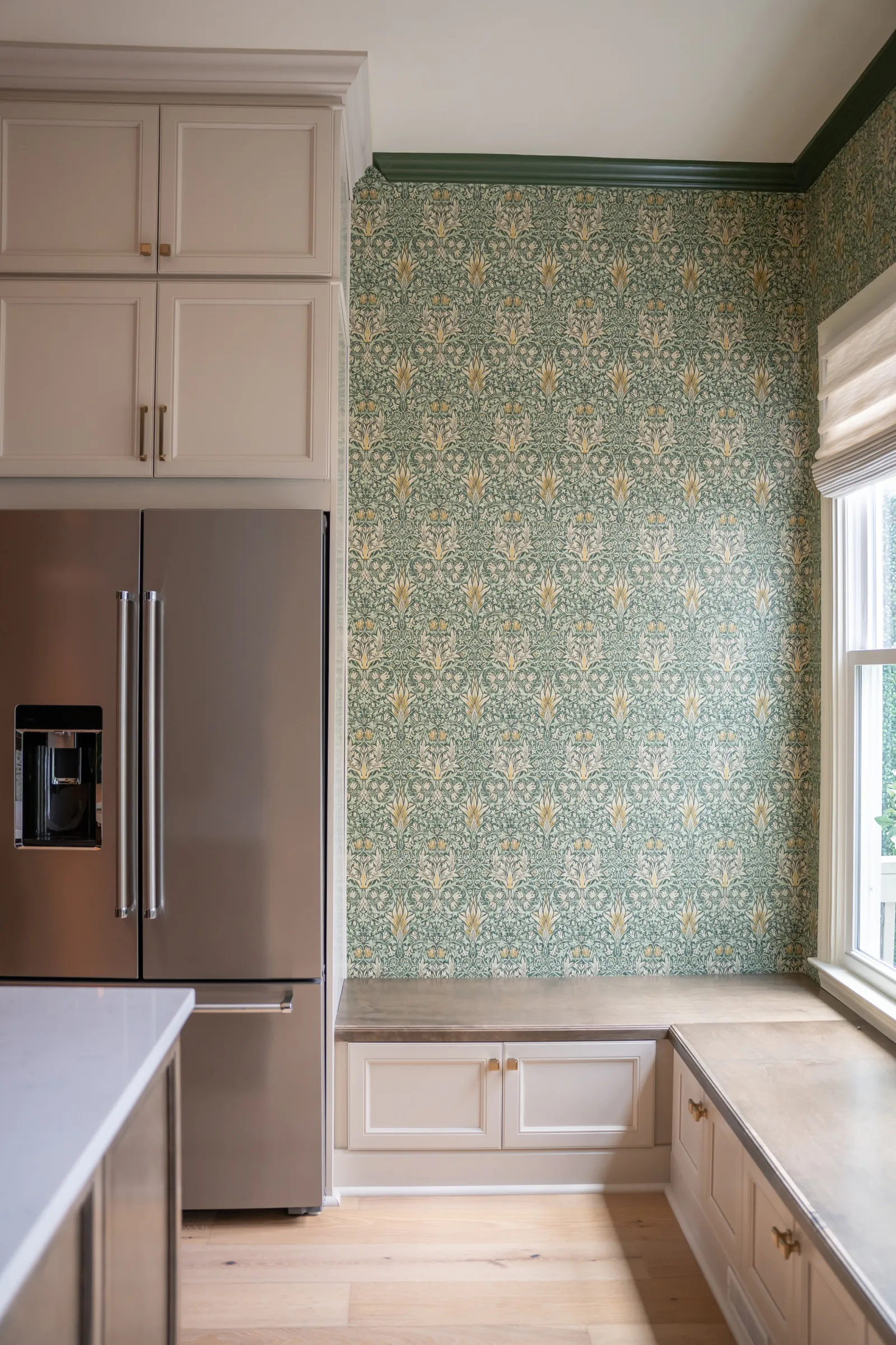 a kitchen with a green and white wall