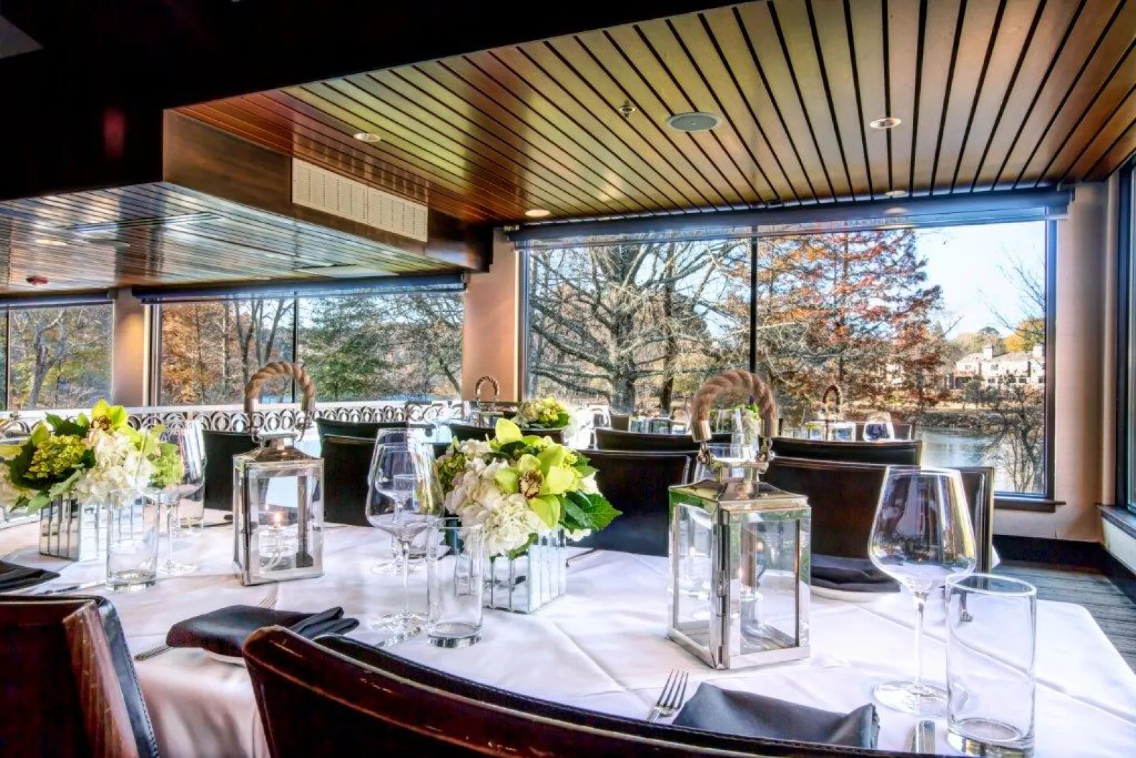 a dining room table in front of a window