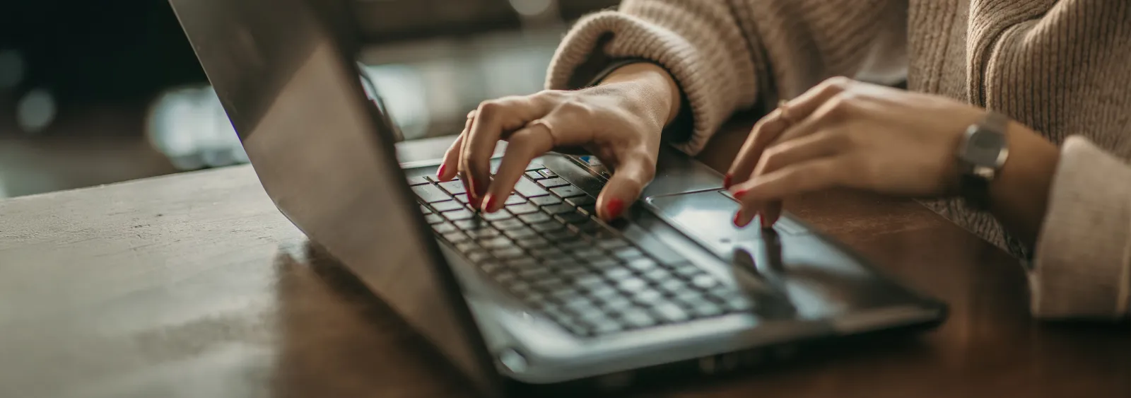 a person typing on a laptop
