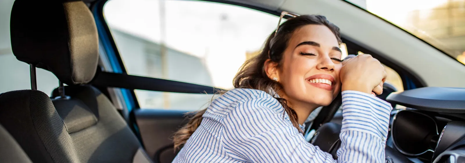 a woman sitting in a car