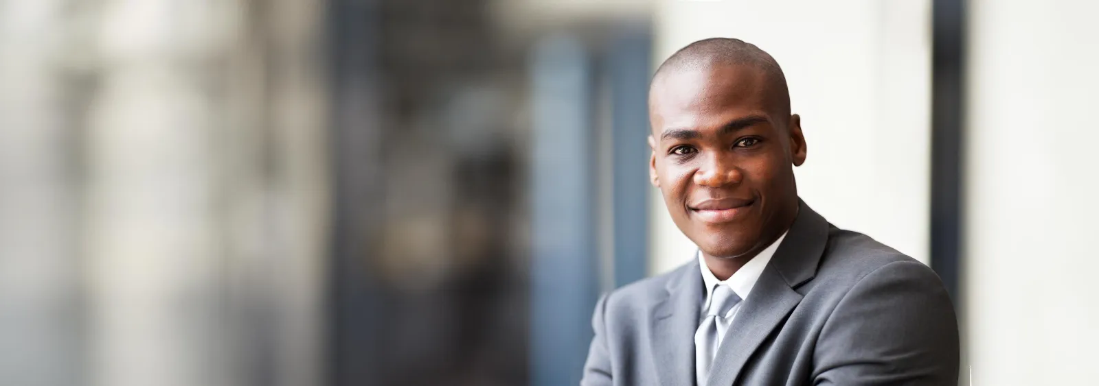 a man in a suit smiling
