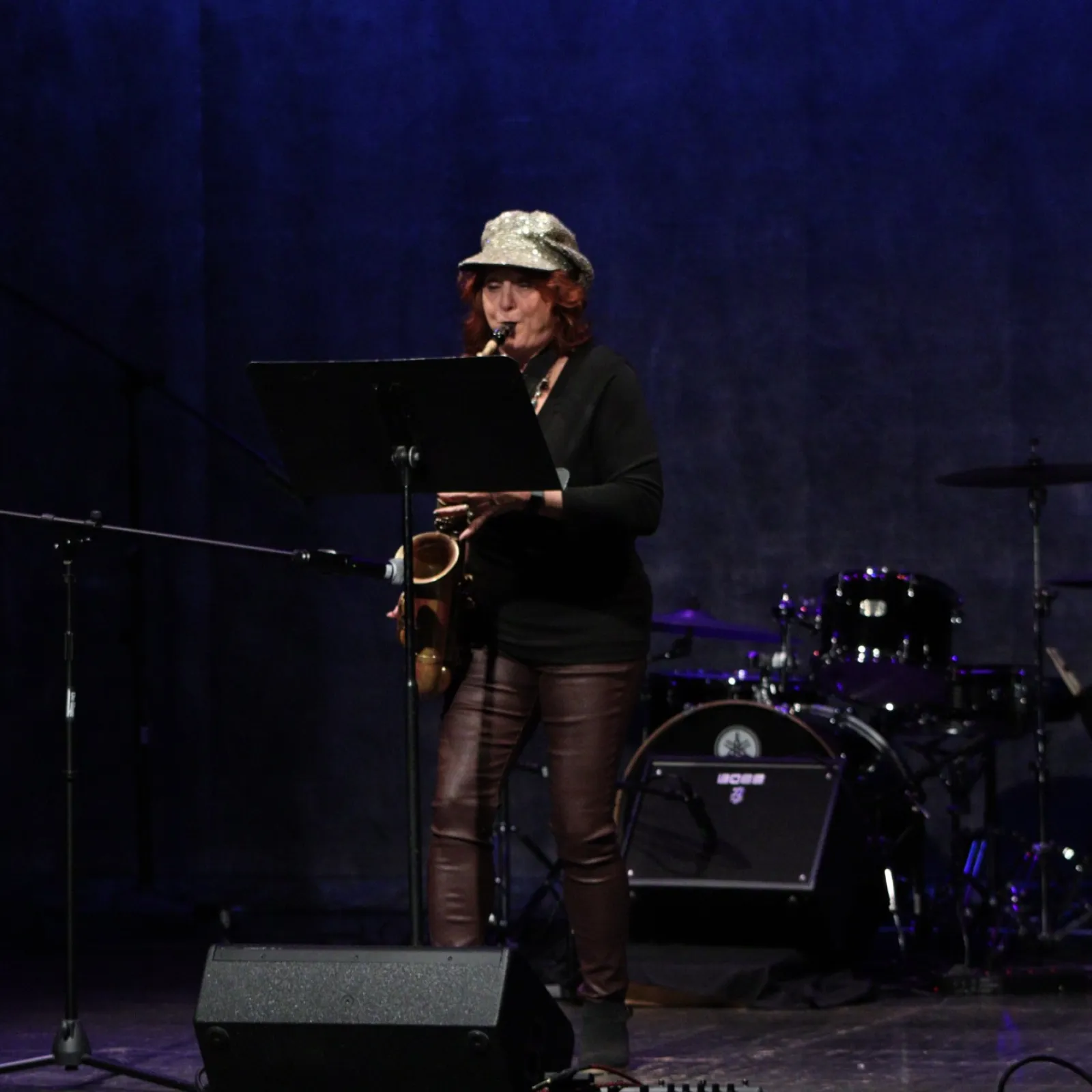 a man playing a guitar on a stage