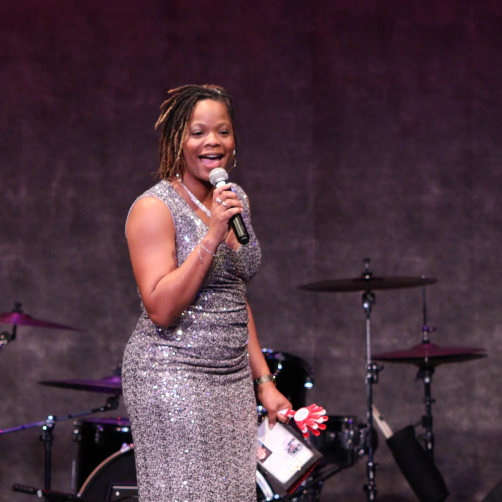 a woman singing into a microphone