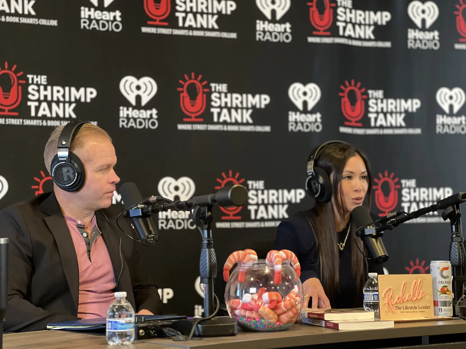 a man and woman wearing headphones