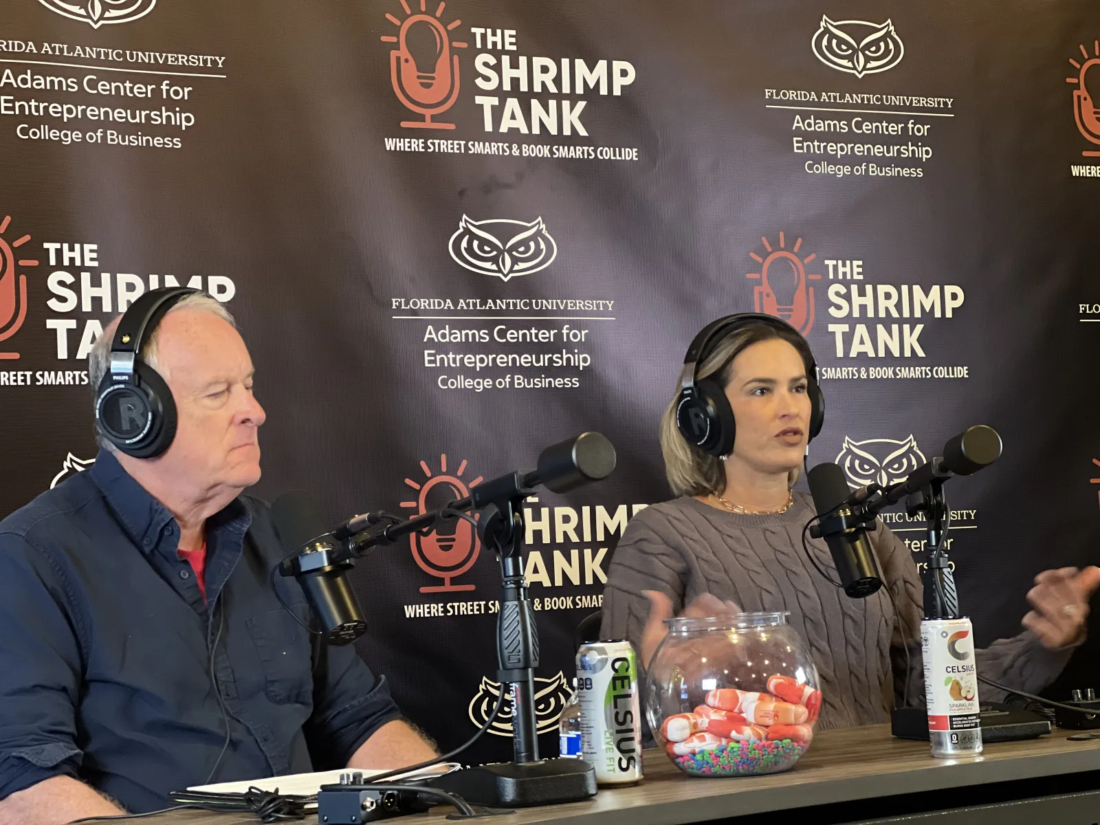 a man and woman wearing headphones