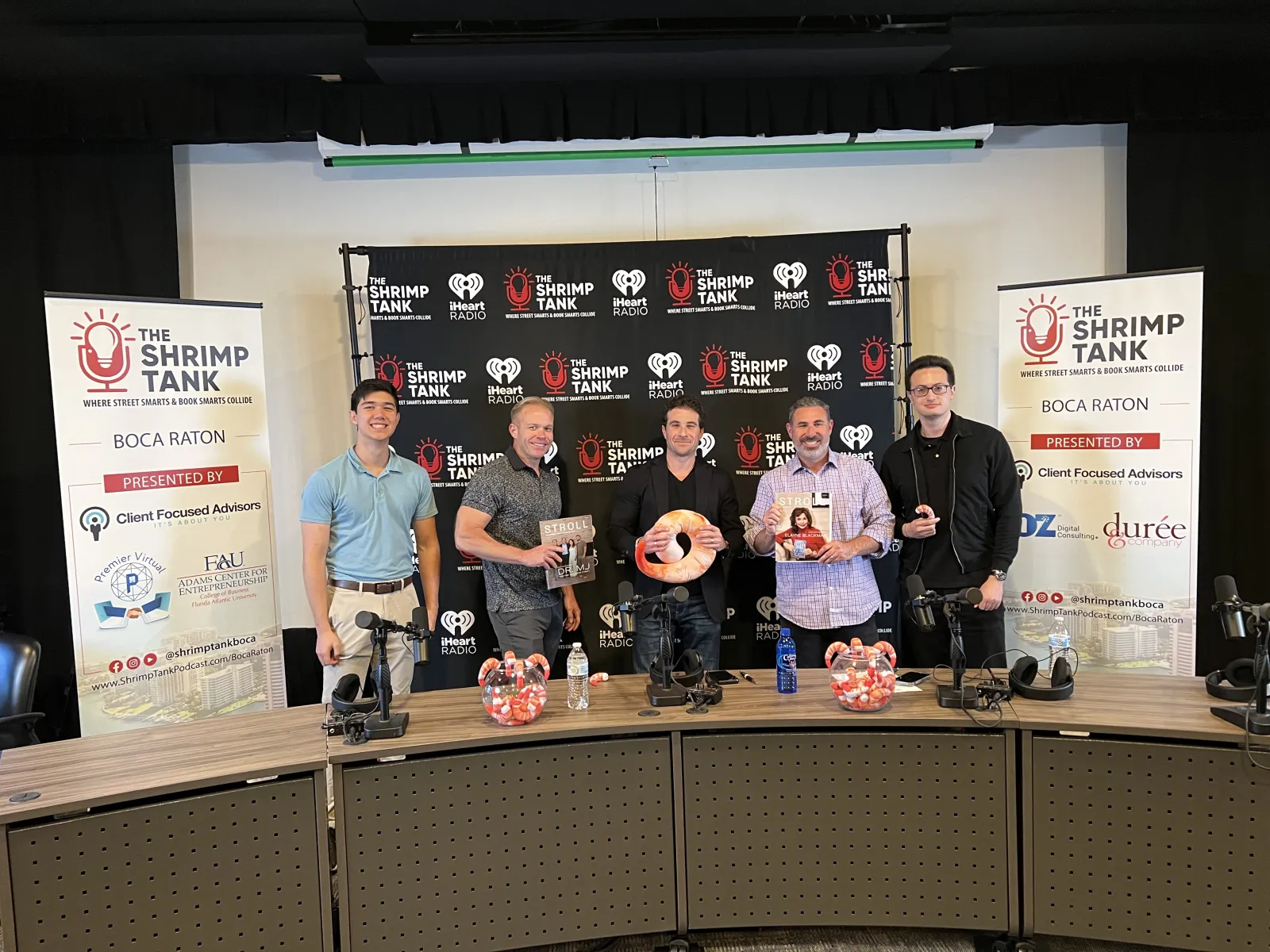 a group of men holding a trophy