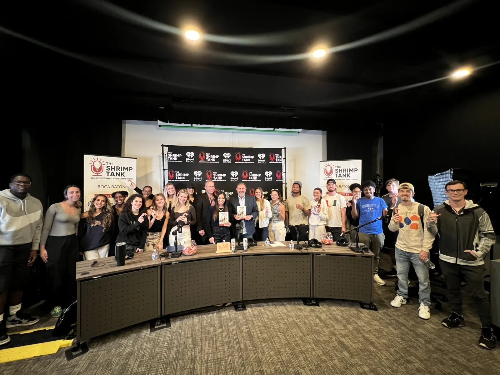 a group of people standing in front of a display