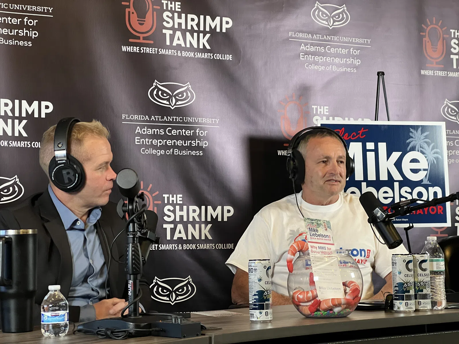 Two men recording a podcast at The Shrimp Tank event with Florida Atlantic University entrepreneurship backdrop.