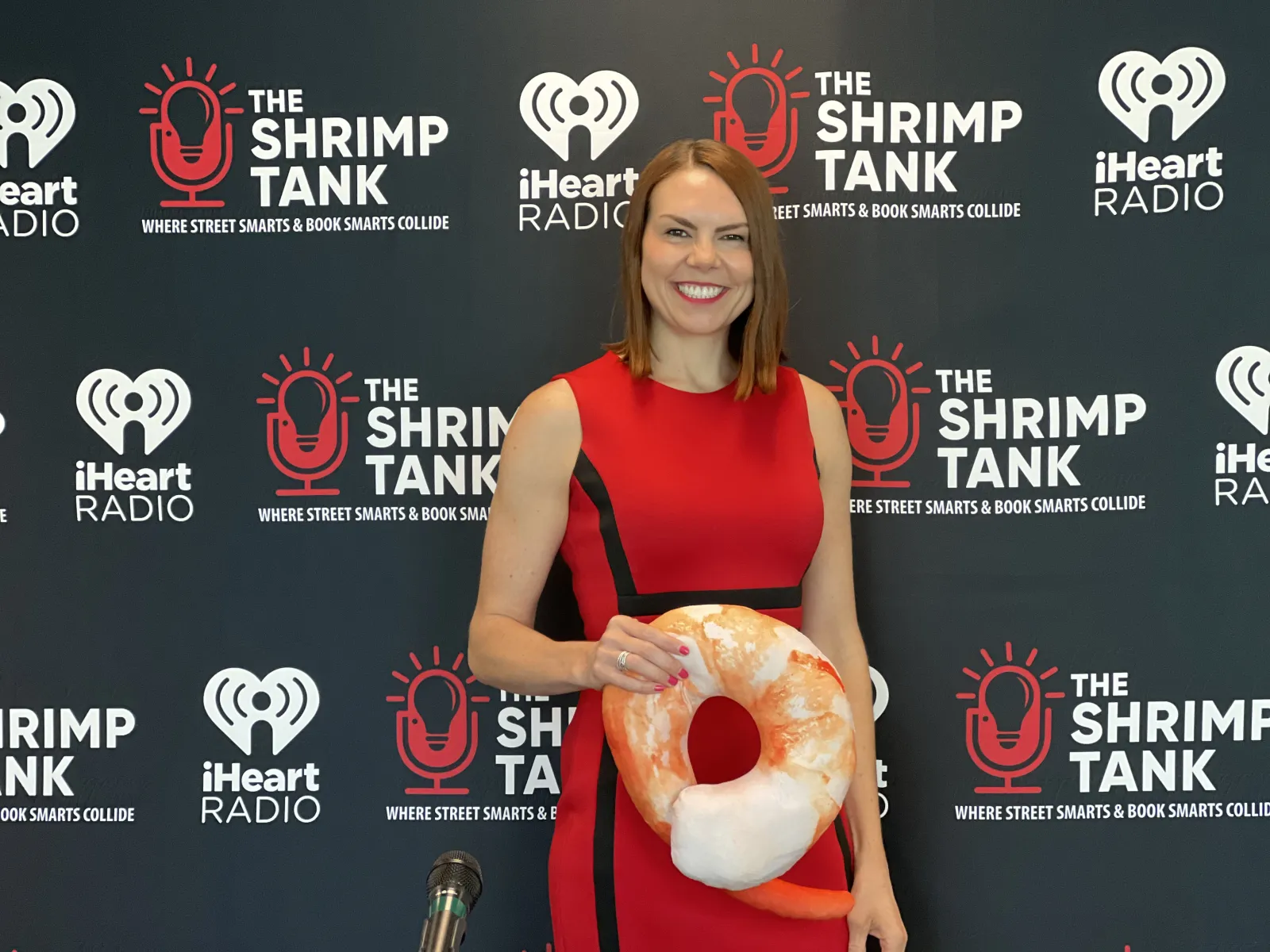 Kate Volman holding a large red and white object