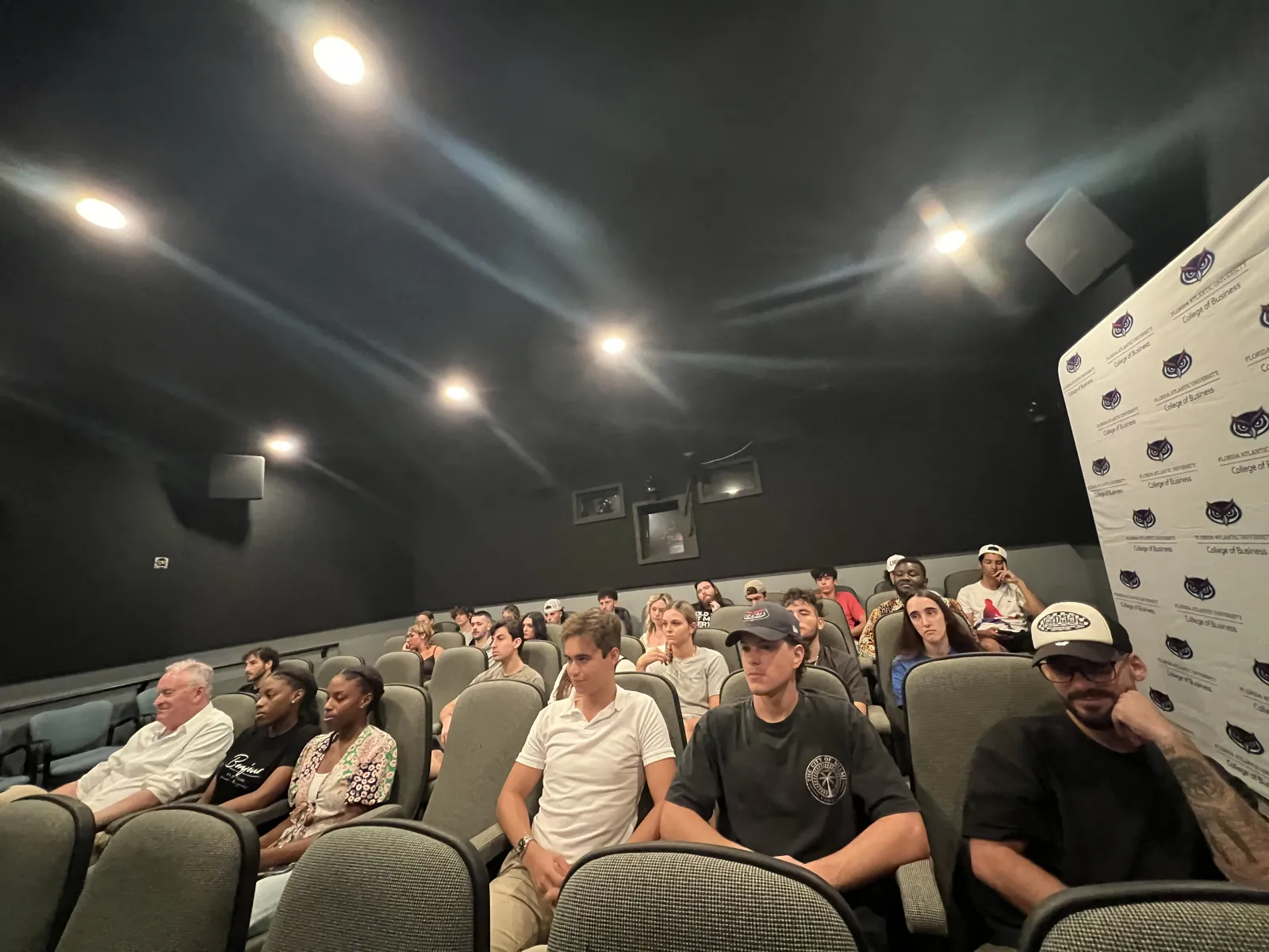 a group of people sitting in a room