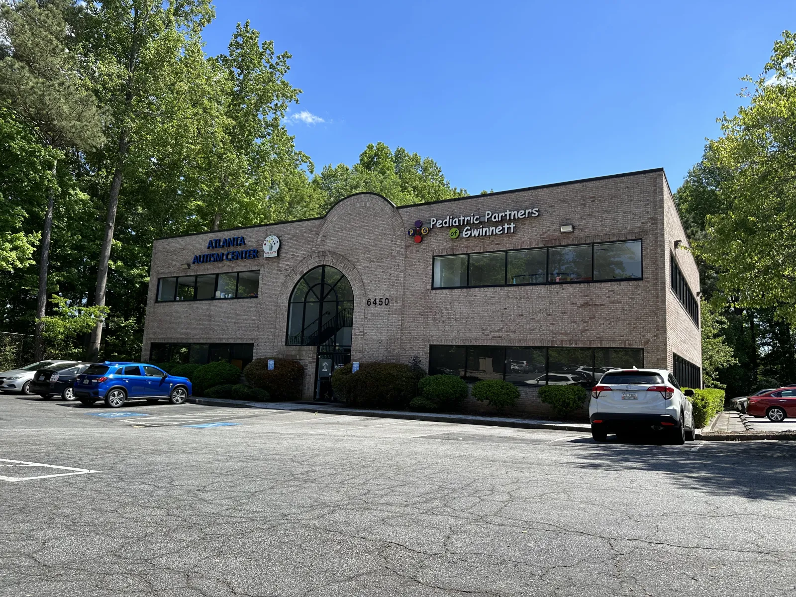 a building with cars parked in front