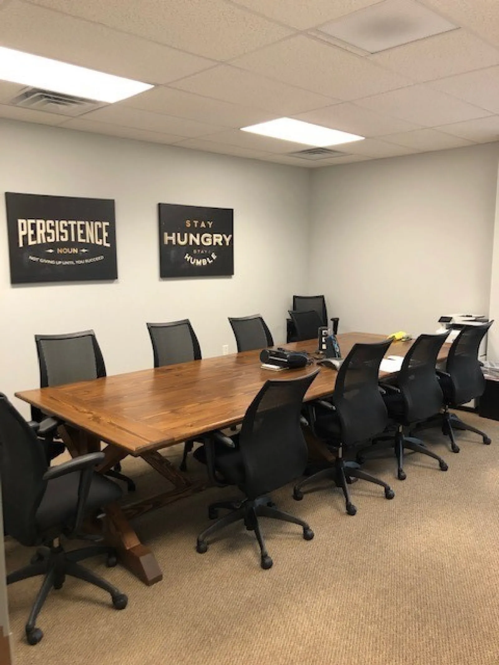 a conference room with a table and chairs