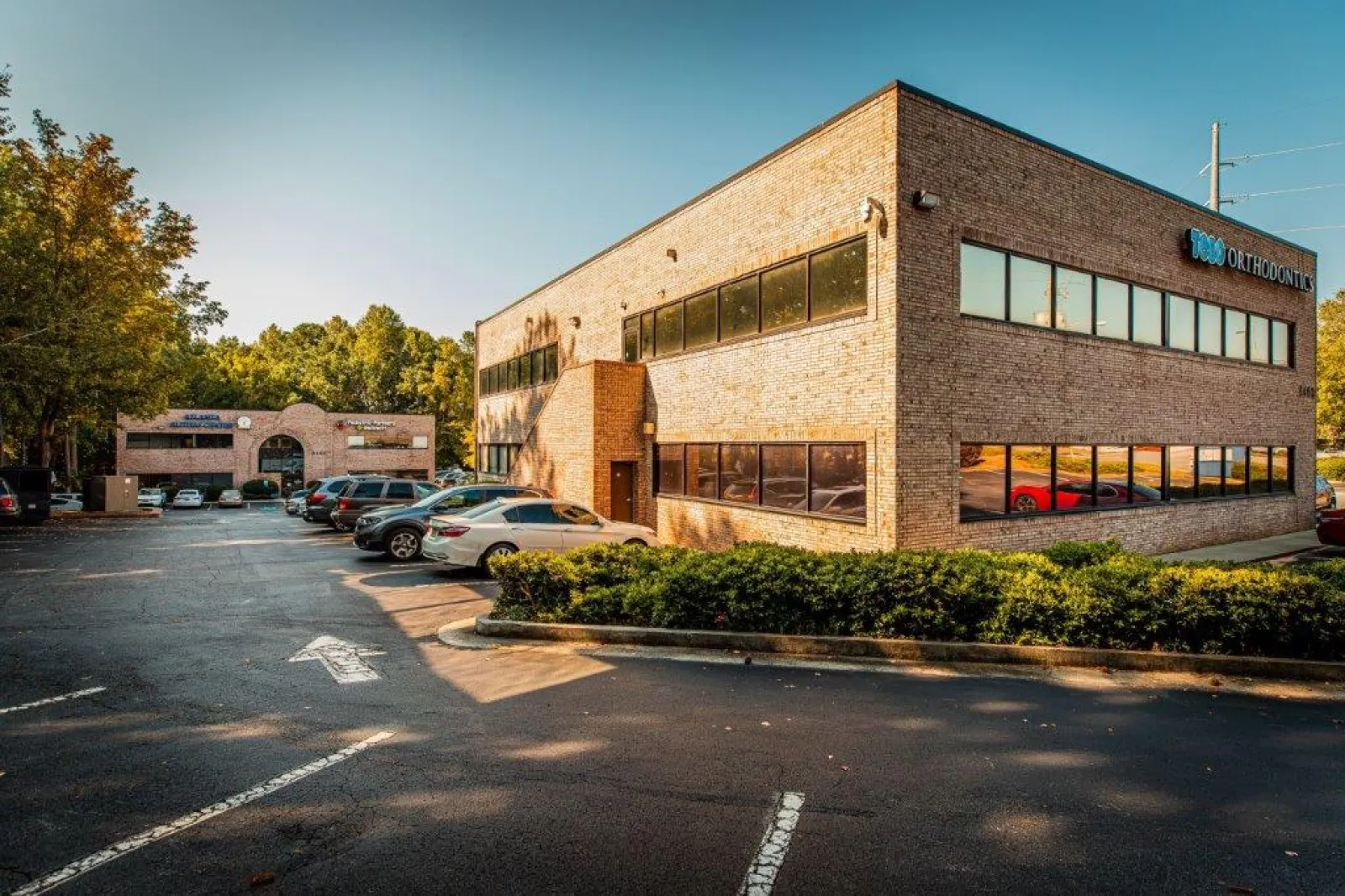 a building with cars parked in front