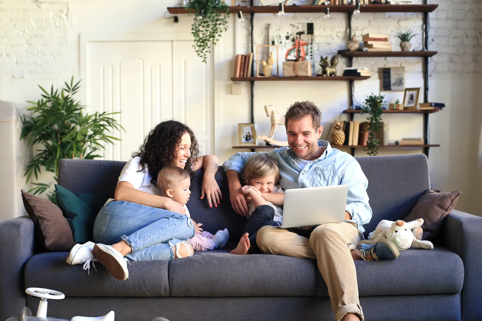 a family sits on a couch