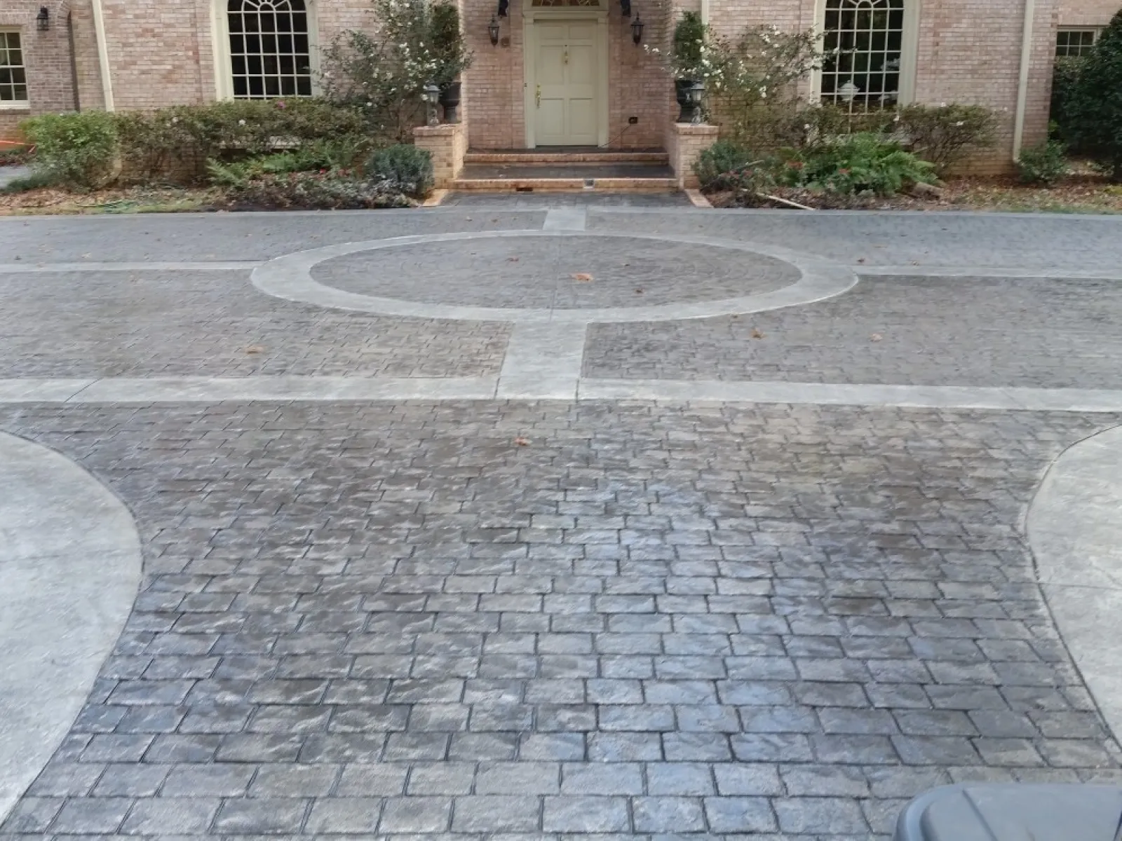 a paved area with a building in the background