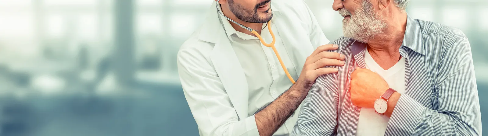 Smiling doctor examining an older man experiencing shoulder pain